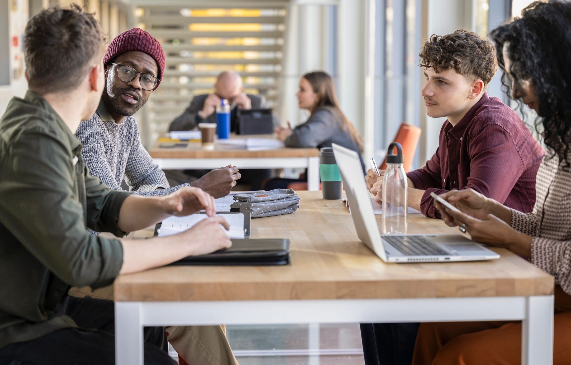 Creative team brainstorming together in a modern office